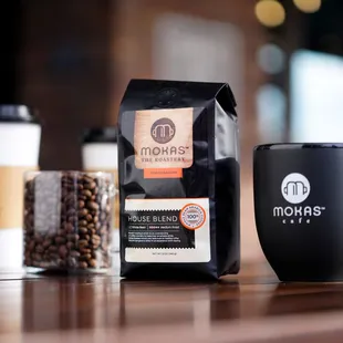 a coffee bag and a cup of coffee