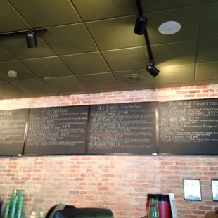 menus on a brick wall