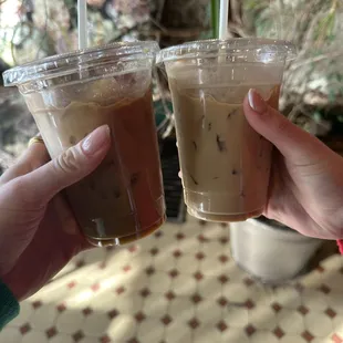 Left: iced oat milk latte add vanilla and honey  Right: plain iced latte caramel drizzle
