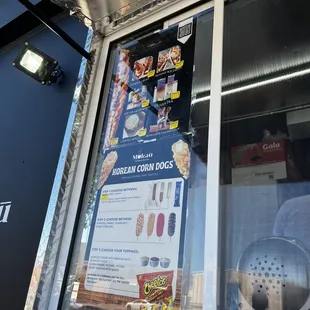 a menu in a window of a food truck
