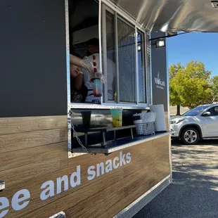 a coffee and snacks truck parked in a parking lot