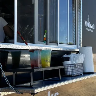 a man standing behind a food truck