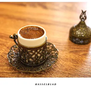 a cup of coffee on a saucer