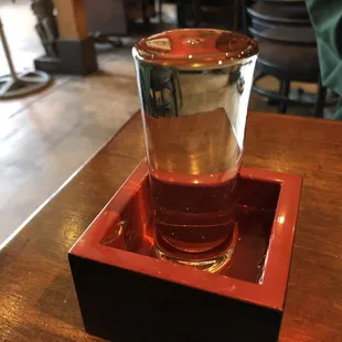 a glass plum wine. the waitress gave us more later since i guess it isn't supposed to come in this glass.