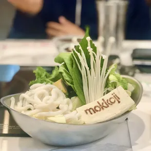 a bowl of noodles and vegetables