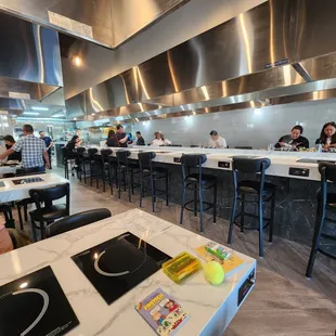 people sitting at tables in a restaurant