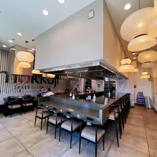 a restaurant with a long counter