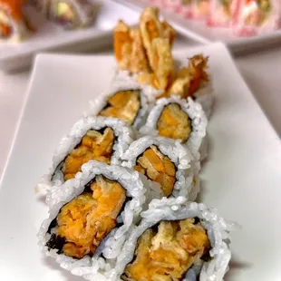 a plate of sushi rolls