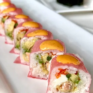a plate of sushi rolls