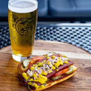 a hot dog and a glass of beer