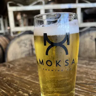 a glass of beer on a table