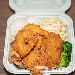 a close up of a meal in a styrofoam container