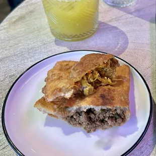 Curry Chicken + Beef Patty Empanadas with a Pineapple Ginger Juice