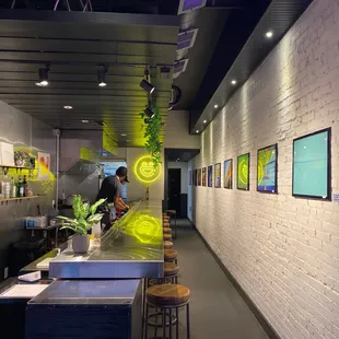 a bar with a counter and stools