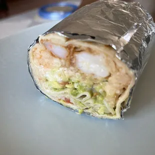 Shrimp burrito with guacamole and pick de gallo. Very tasty.