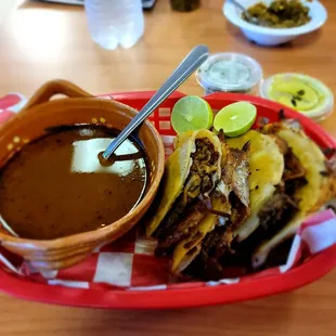 Quesabirria tacos and consomme dipping space.  Perfectly executed birria.