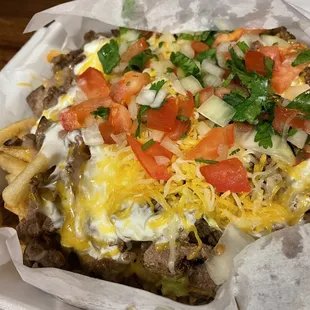 carne asada super fries, easy on the onions