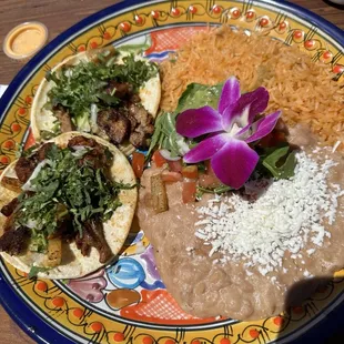 Pastor tacos with rice and beans