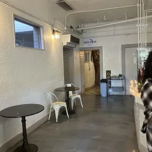 a woman standing in a coffee shop