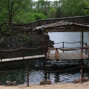 a gazebo in the middle of a pond