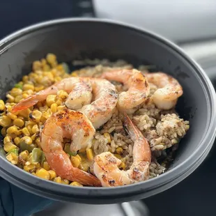 a bowl of shrimp and rice