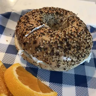 a bagel and orange slices