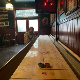 a man sitting at a shuffle table