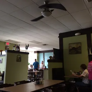 people sitting at tables in a restaurant