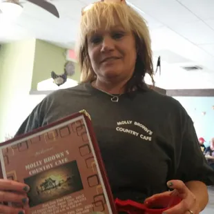 a woman holding a menu