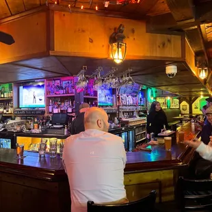 a group of people sitting at a bar