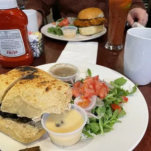 Nashville hot chicken and mushroom au jus. Both with side salads