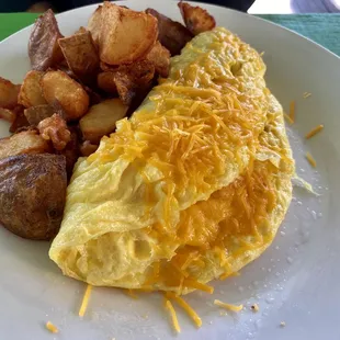 Cheese and bacon omelette and huge home fries