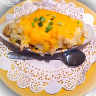 Shepard's Pie - Homemade Pie with Ground Beef, Carrots, and Peas, Topped with Mashed Potatoes and Melted Cheddar