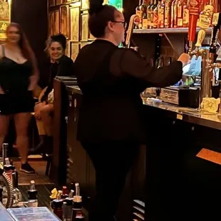 a bar with people at the bar
