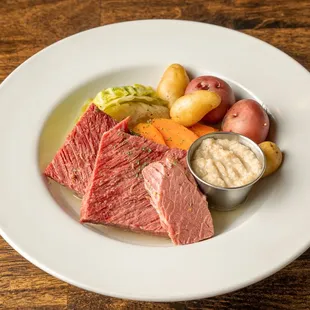 Experience the taste of tradition with our tender Corned Beef &amp; Cabbage - a classic Irish favorite that never goes out of style!