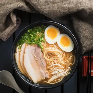 a bowl of ramen noodles with a boiled egg