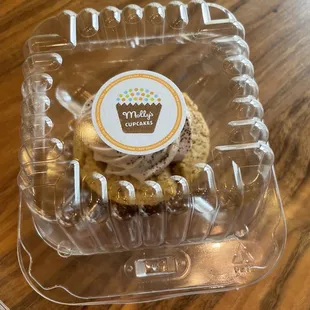 a cupcake in a plastic container