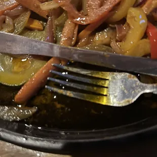 veggie fajitas in puddle of grease