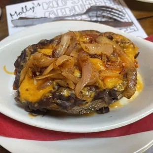 Spud (with cheese, sautéed onions, shredded chicken, and black beans)