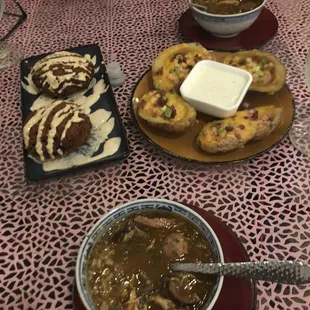 a bowl of soup and a plate of bread