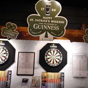 darts, darts, and shamrocks on the wall