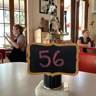 The table numbers, recycled trophies.