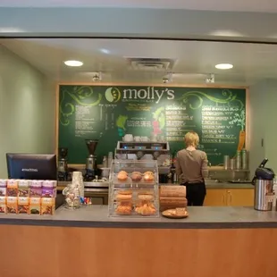 a woman standing at the counter