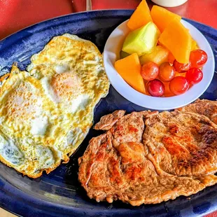 Steak medium rare, eggs over easy, fruit, coffee, sourdough toast, make for a perfect start for your morning!