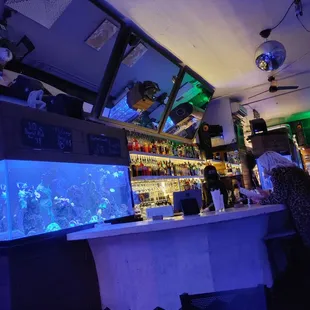 a bar with a fish tank
