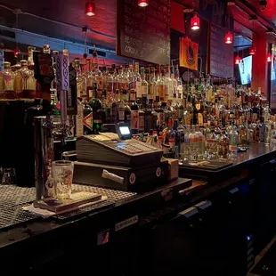 a bar filled with liquor bottles