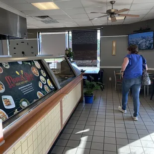 a woman standing in a restaurant