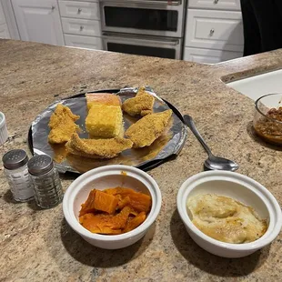 Catfish, cornbread, mashed potatoes and gravy, yams and chili beans