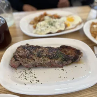 Country Fried Steak ($16.50) with my choices of sourdough toast, home potatoes, and two sunny side up eggs
