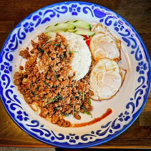 Mom&apos;s Holy Basil Pork. Simple.  Packed with flavor.  Just enough heat.  The fried eggs out it over the top.  Amazing!